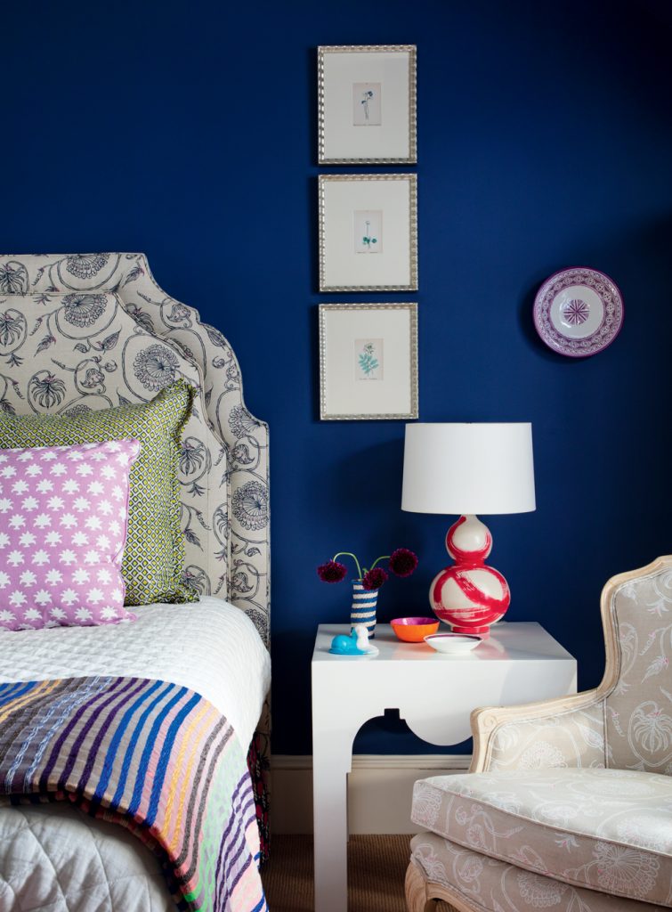 This headboard and chair are done in Skok’s “Jessie” pattern, named for her eldest daughter; at the foot of the bed is a throw that Skok purchased in Morocco during a trip with her sister. (Sarah Winchester | Styling by Jennifer Figge)